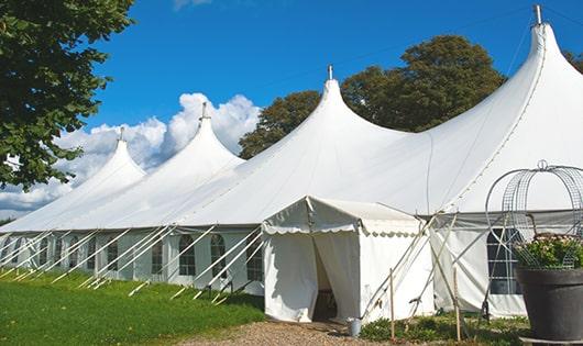 a line of sleek and modern portable restrooms ready for use at an upscale corporate event in Pierson